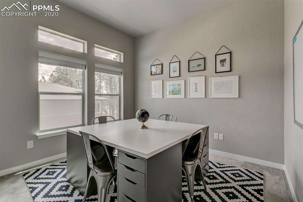 16430 Dancing Bear Lane Monument, CO 80132 - Photo 28 of 50 a view of a dining room with furniture and window