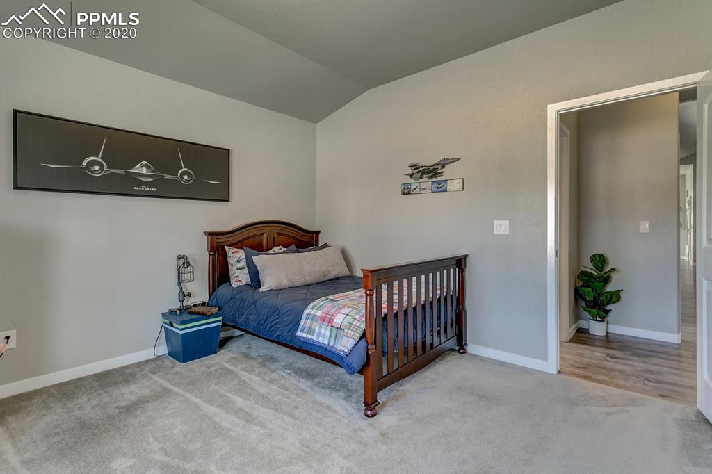 16430 Dancing Bear Lane Monument, CO 80132 - Photo 31 of 50 a bedroom with bed and wooden floor