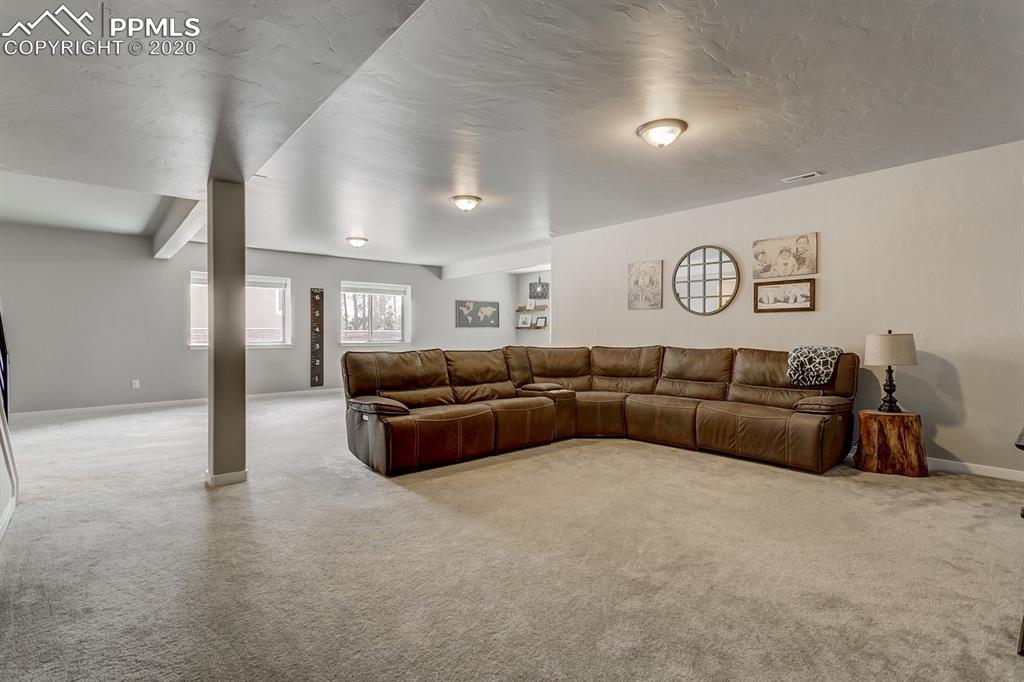 16430 Dancing Bear Lane Monument, CO 80132 - Photo 39 of 50 a living room with furniture and a couch