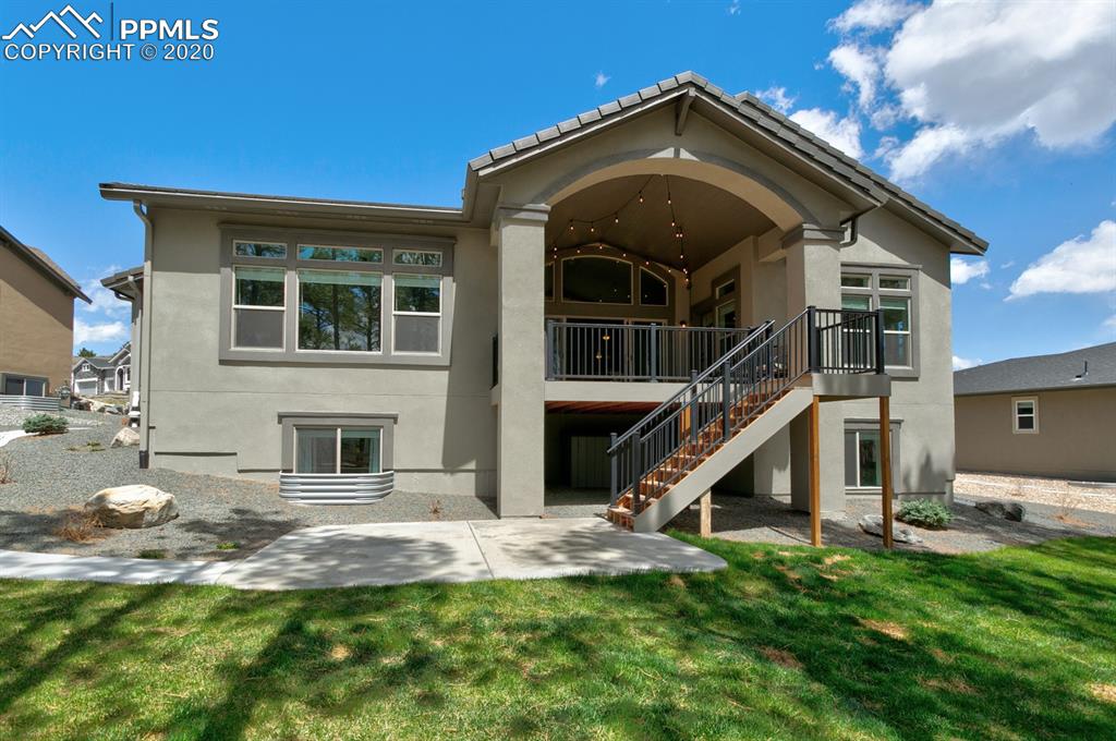 16430 Dancing Bear Lane Monument, CO 80132 - Photo 47 of 50 a front view of a house with a yard