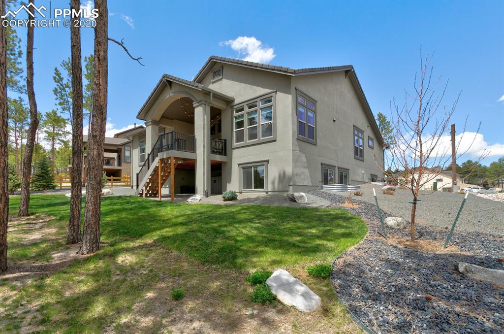 16430 Dancing Bear Lane Monument, CO 80132 - Photo 48 of 50 a view of a house with a yard
