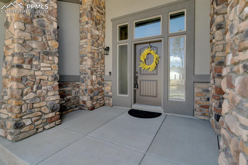 16430 Dancing Bear Lane Monument, CO 80132 - Photo 5 of 50 a view of an entrance to house with yard