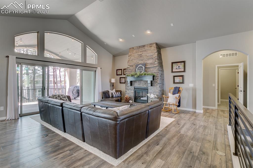 16430 Dancing Bear Lane Monument, CO 80132 - Photo 7 of 50 a kitchen with stainless steel appliances granite countertop a stove and a refrigerator