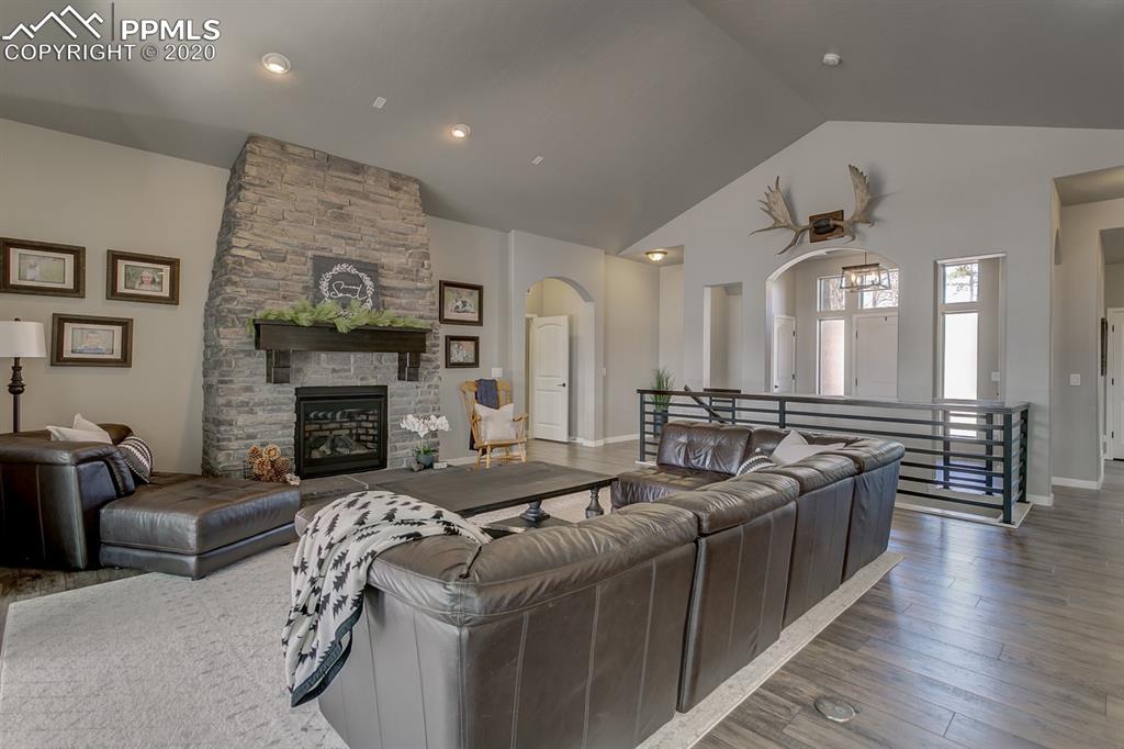 16430 Dancing Bear Lane Monument, CO 80132 - Photo 8 of 50 a living room with furniture and a fireplace