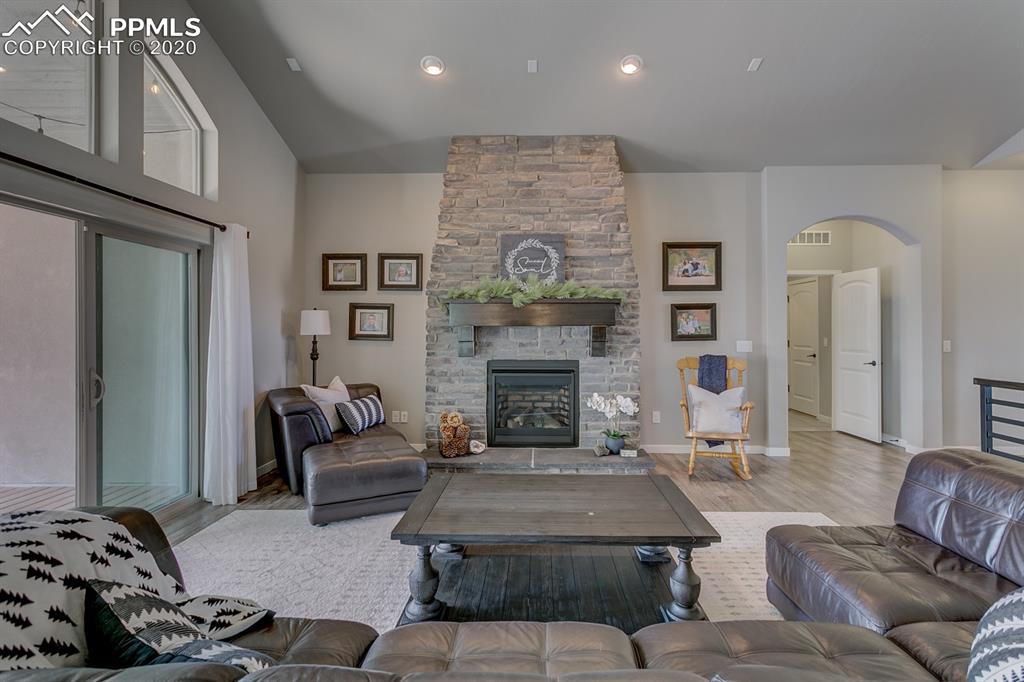 16430 Dancing Bear Lane Monument, CO 80132 - Photo 9 of 50 a living room with furniture and a fireplace