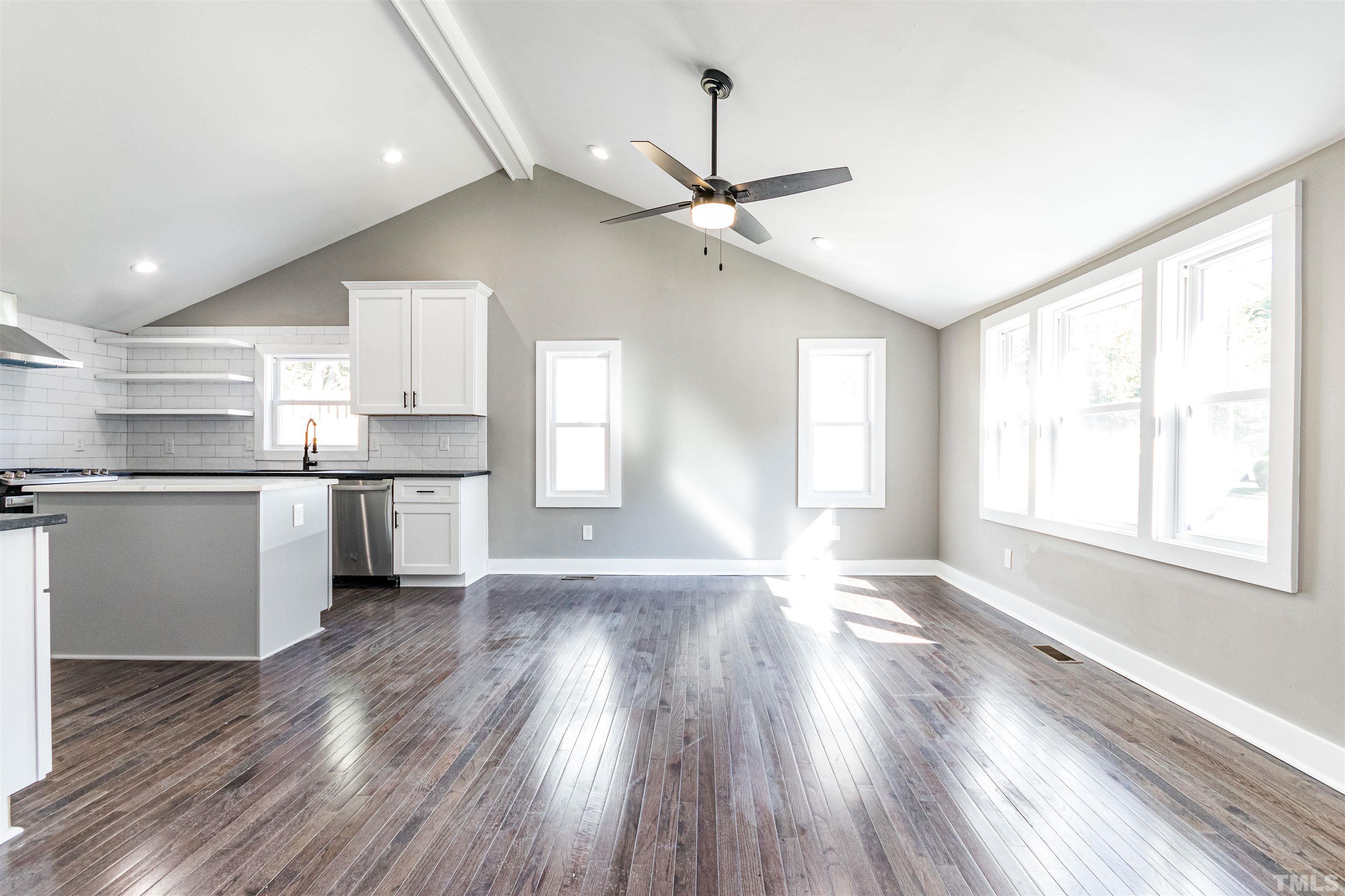824 Coleman Street Raleigh, NC 27610 - Photo 5 of 30 a view of an empty room with window and wooden floor