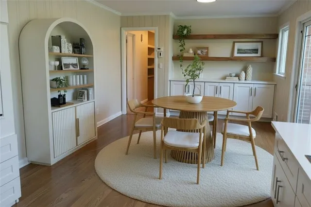 a dining room with furniture and window