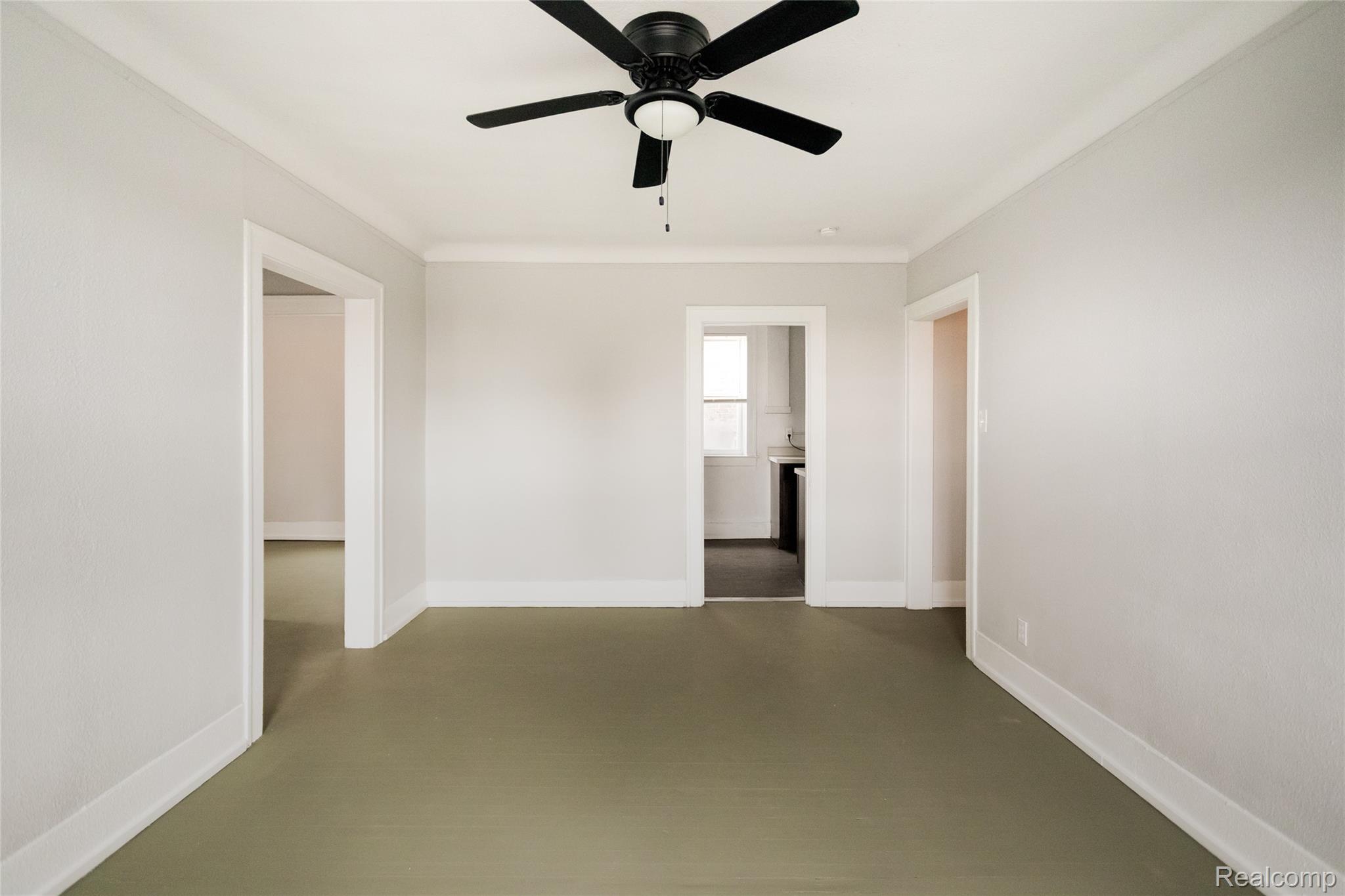 2683 Central Street Detroit, MI 48209 - Photo 5 of 10 Unfurnished room featuring a ceiling fan and ornamental molding