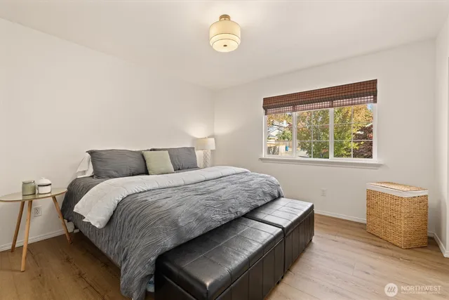 a bedroom with a bed and window