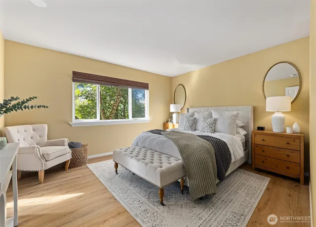 a bedroom with a bed and a couch