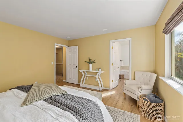 a bedroom with a bed and a couch