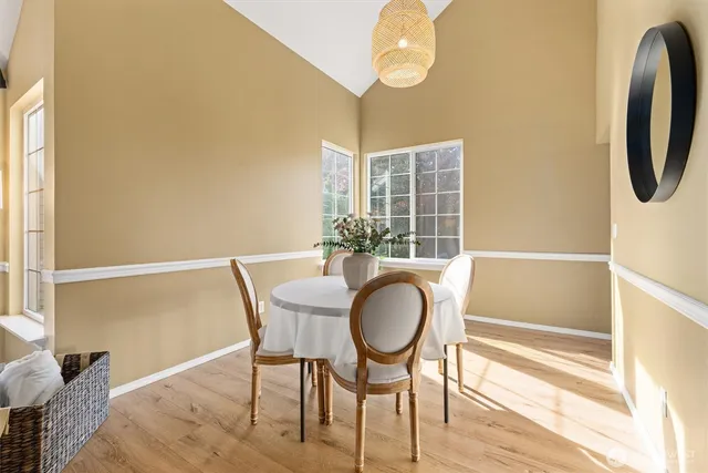a dining room with furniture and window