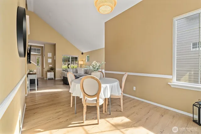 a dining room with furniture and window