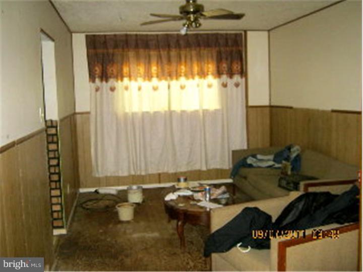 1318 Rainer Road Brookhaven, PA 19015 - Photo 4 of 13 a room with furniture and window