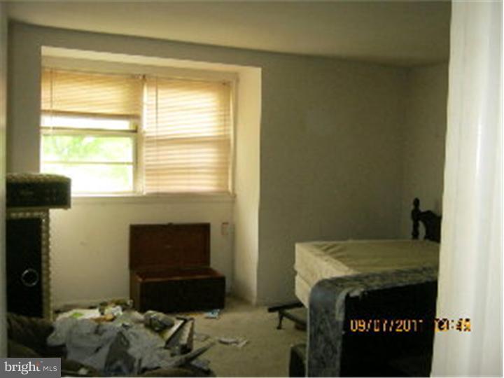 1318 Rainer Road Brookhaven, PA 19015 - Photo 6 of 13 a room with a bed and a window