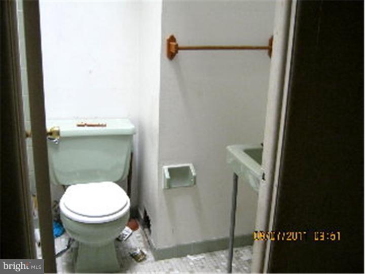 1318 Rainer Road Brookhaven, PA 19015 - Photo 10 of 13 a bathroom with a toilet and a shower