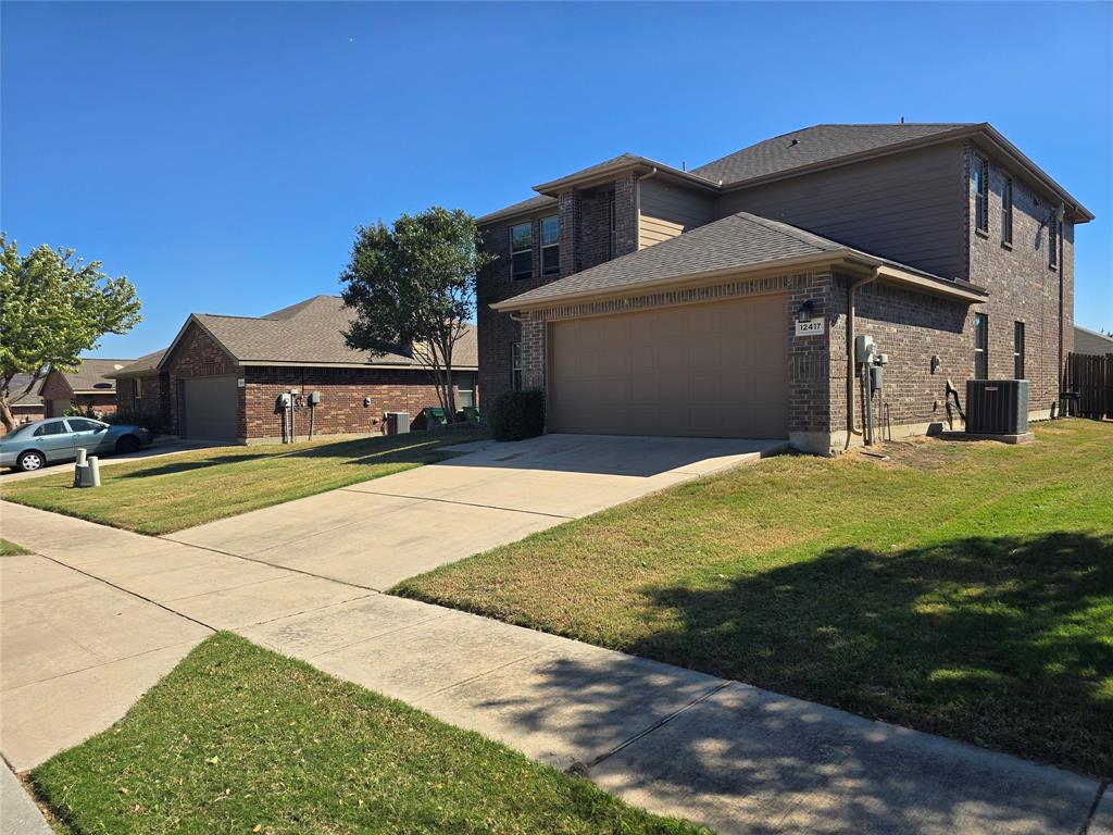 a front view of a house with yard