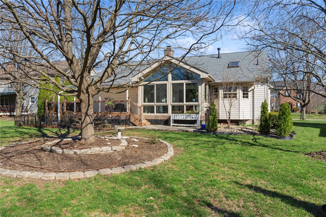 8781 Rupp Farm Drive West Chester, OH 45069 - Photo 44 of 48 This home features a deck, sunroom, and a beautifully maintained lawn.