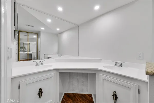 a bathroom with a sink vanity and a mirror