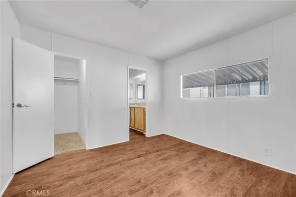 a bedroom with a bed and closet