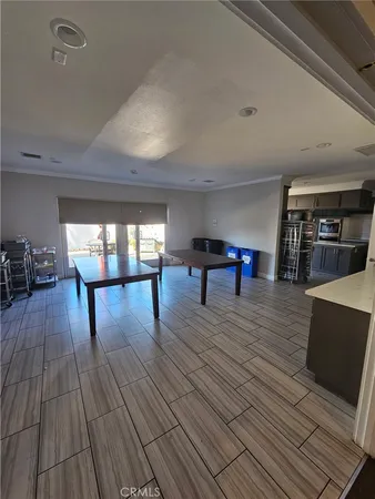 a kitchen with stainless steel appliances a stove a sink and a refrigerator