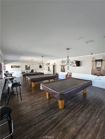 a living room with couch and wooden floor