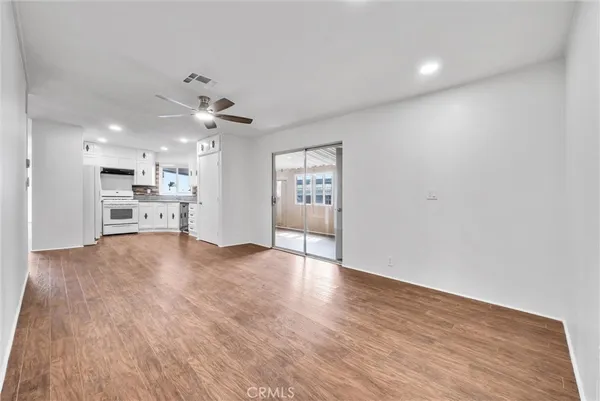 a view of a kitchen with a sink and a stove top oven
