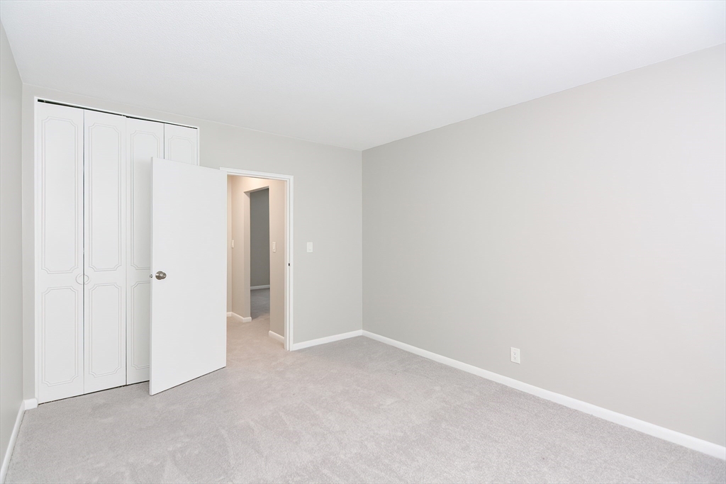 149 Lake Shore Road, Unit 2 Boston, MA 02135 - Photo 14 of 38 a view of an empty room