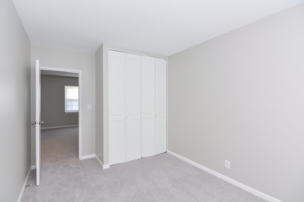 149 Lake Shore Road, Unit 2 Boston, MA 02135 - Photo 15 of 38 a view of an empty room