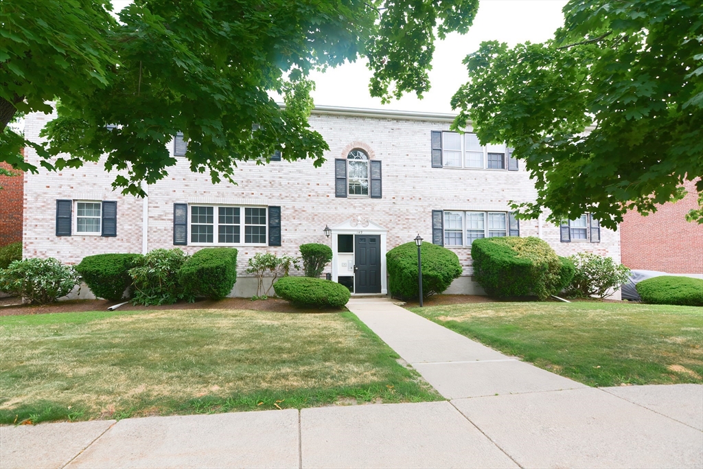 149 Lake Shore Road, Unit 2 Boston, MA 02135 - Photo 2 of 38 a view of a house with a backyard