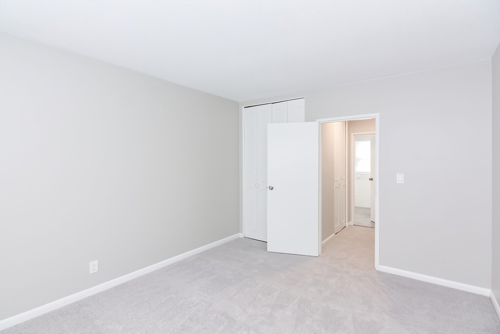 149 Lake Shore Road, Unit 2 Boston, MA 02135 - Photo 21 of 38 a view of an empty room