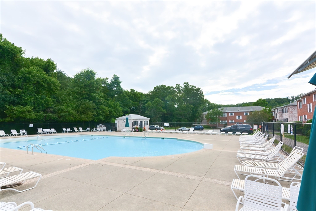 149 Lake Shore Road, Unit 2 Boston, MA 02135 - Photo 28 of 38 a view of swimming pool with seating space