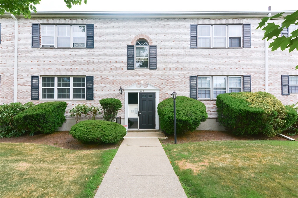 149 Lake Shore Road, Unit 2 Boston, MA 02135 - Photo 37 of 38 a front view of a house with garden