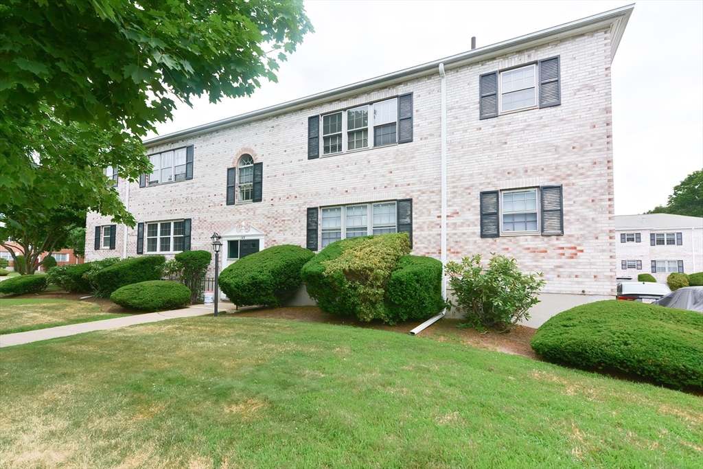 149 Lake Shore Road, Unit 2 Boston, MA 02135 - Photo 38 of 38 a view of a front of house with a yard