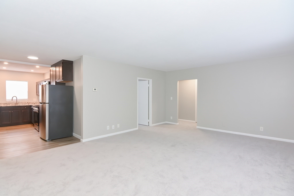 149 Lake Shore Road, Unit 2 Boston, MA 02135 - Photo 9 of 38 a view of an empty room