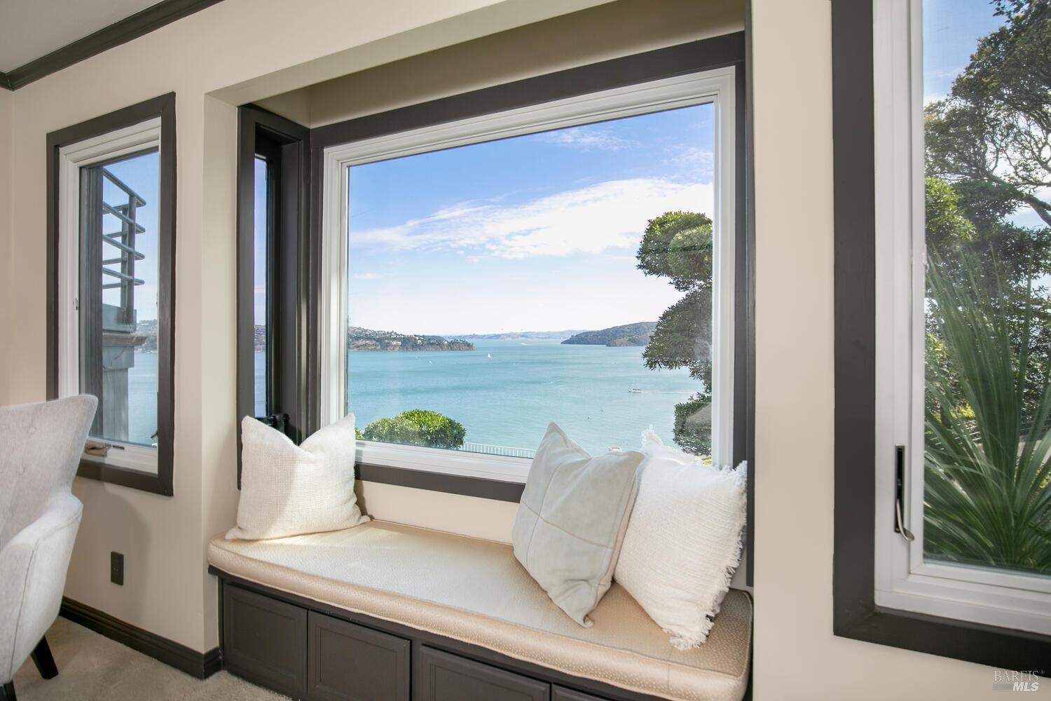 31 Edwards Avenue Sausalito, CA 94965 - Photo 22 of 51 a view of a balcony with chair and floor to ceiling window