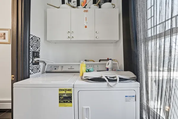 a utility room with dryer and washer