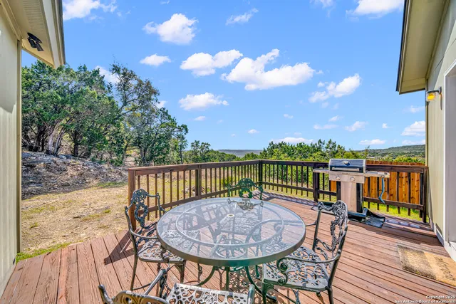 a view of a balcony with furniture