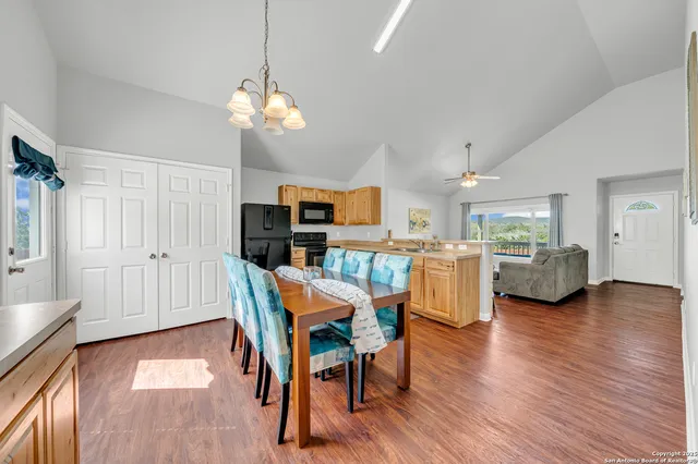 a view of a dining room with furniture and wooden floor