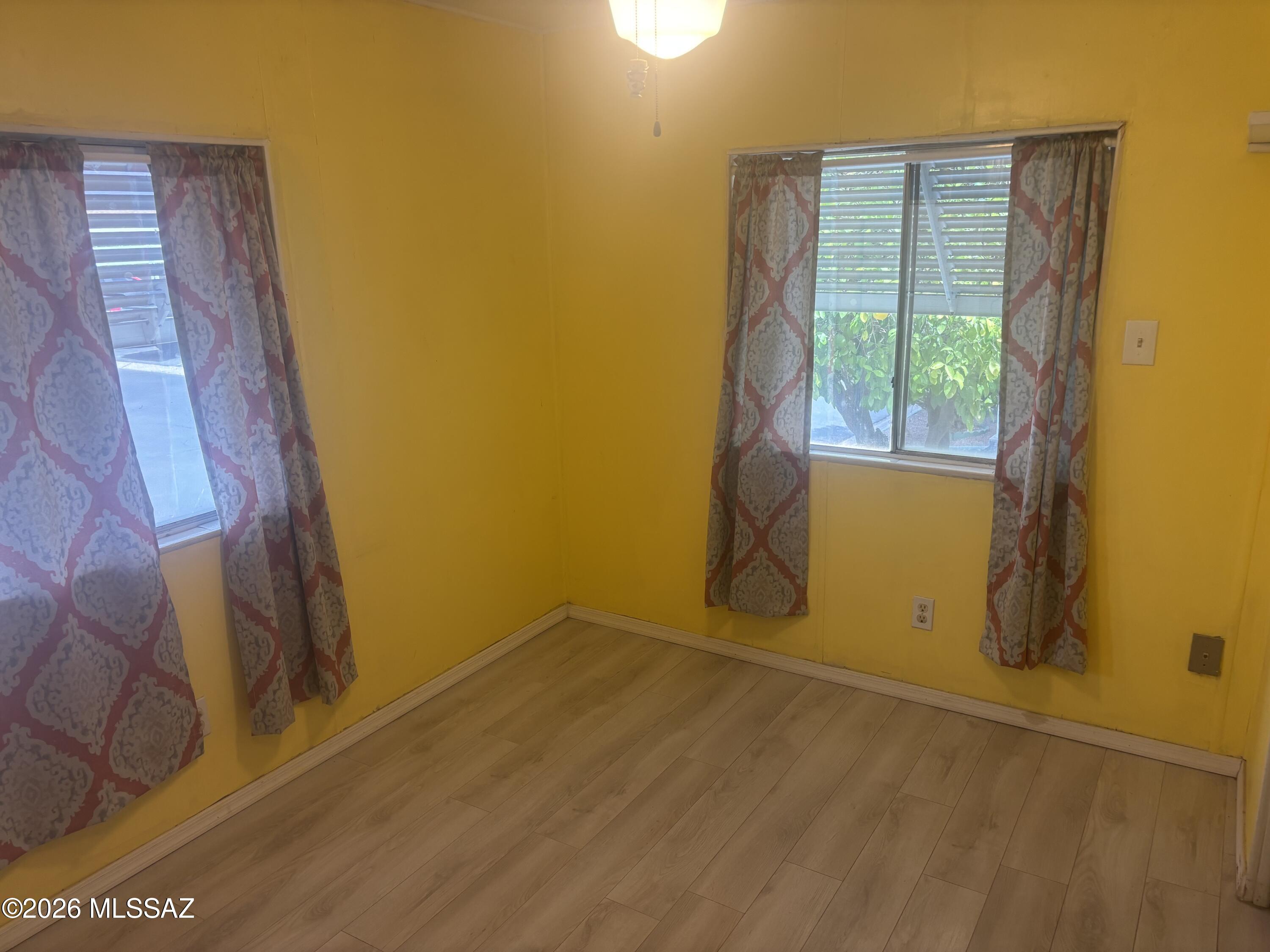 4550 North Flowing Wells Road, Unit 65 Tucson, AZ 85705 - Photo 27 of 50 a view of an empty room with a window