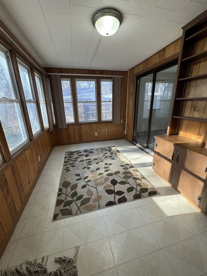 1103 37th St Court Moline, IL 61265 - Photo 11 of 13 a bedroom with a bed and a large window