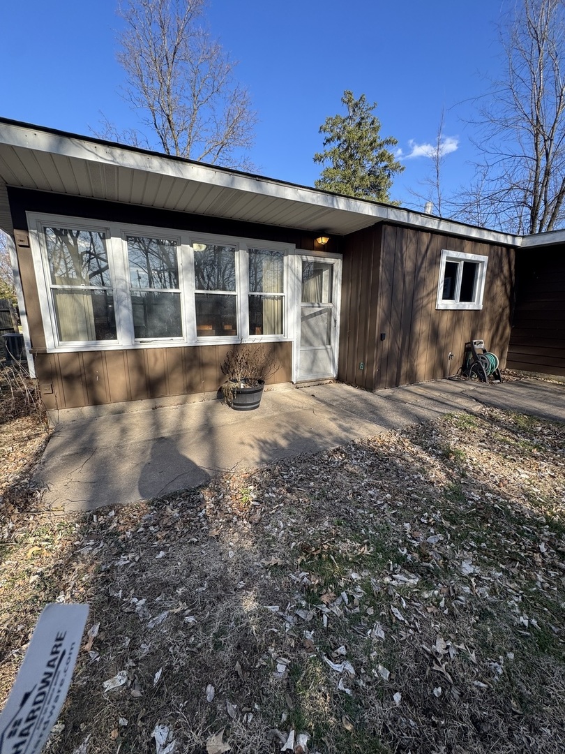 1103 37th St Court Moline, IL 61265 - Photo 13 of 13 a front view of a house with a garden