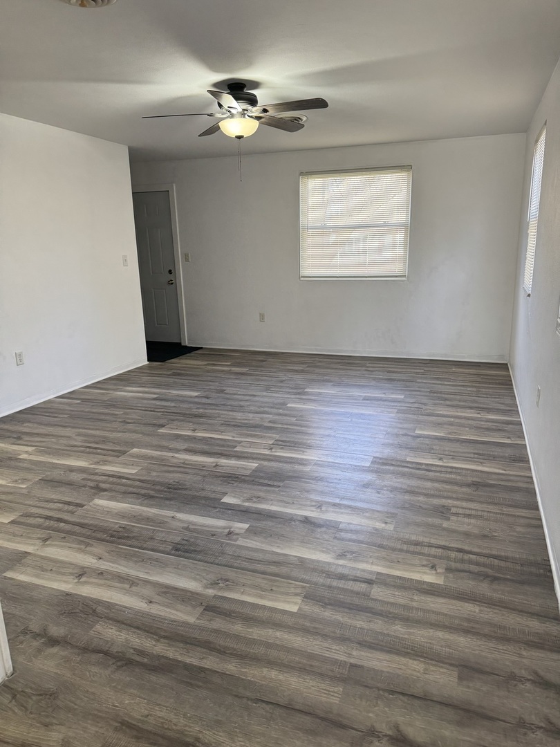 1103 37th St Court Moline, IL 61265 - Photo 4 of 13 a view of room window and wooden floor