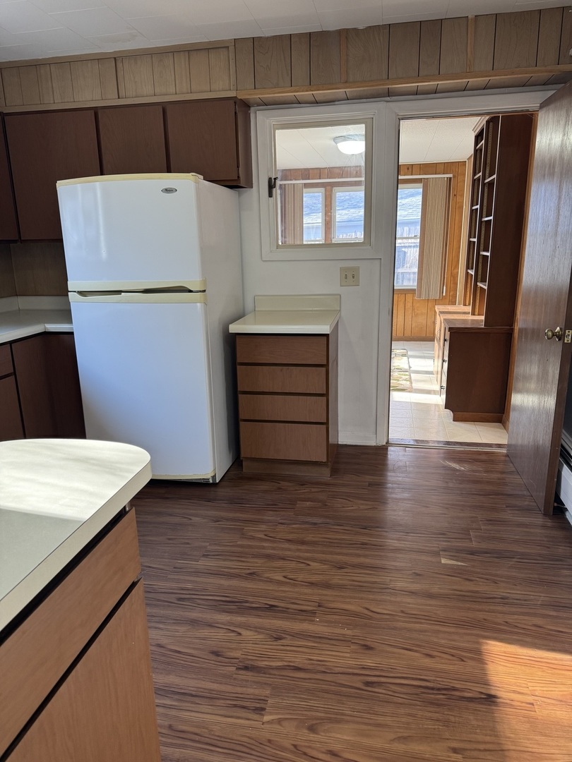 1103 37th St Court Moline, IL 61265 - Photo 10 of 13 a view of kitchen with cabinets and wooden floor