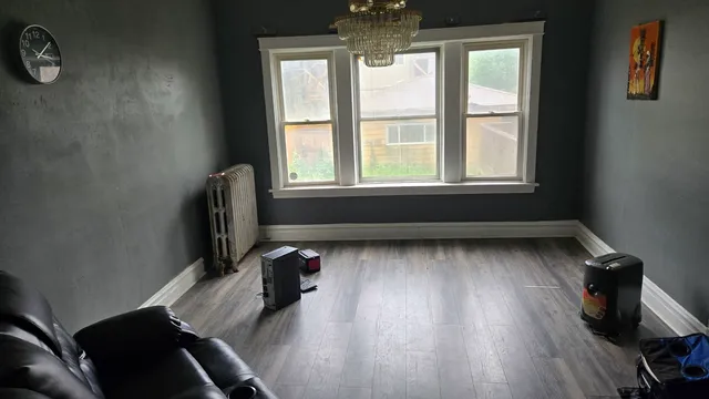 a view of workspace with wooden floor and windows