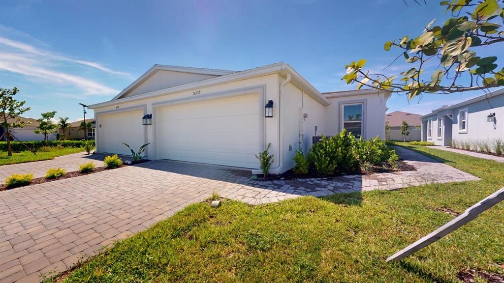 16132 Ivy Ridge Port Charlotte, FL 33953 - Photo 1 of 1 a view of a house with a patio