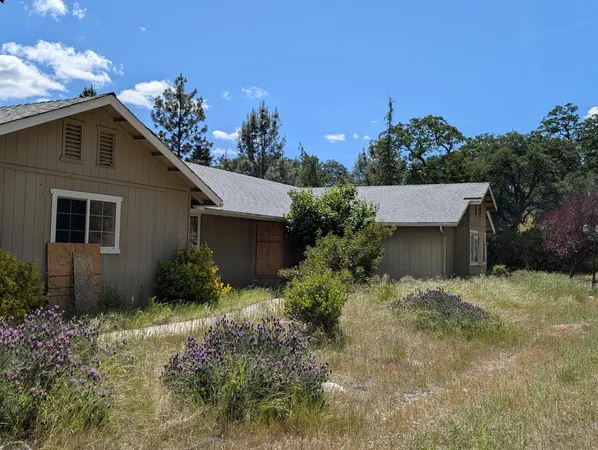 a house with trees in the background