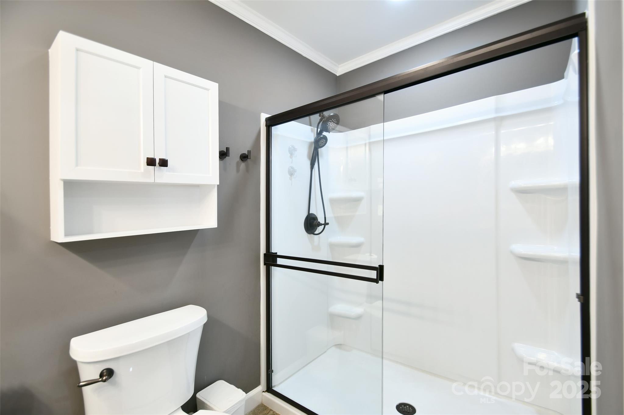 1820 Irish Potato Road Concord, NC 28025 - Photo 17 of 35 a bathroom with a shower and a toilet