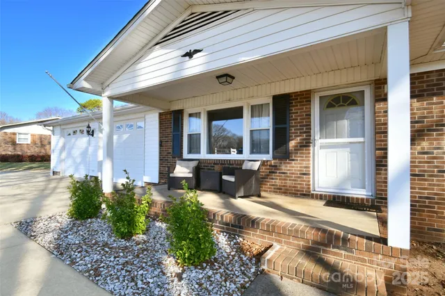 a front view of a house with large windows