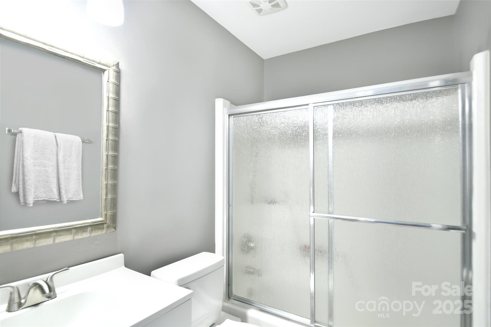 1820 Irish Potato Road Concord, NC 28025 - Photo 23 of 35 a bathroom with a shower and a sink